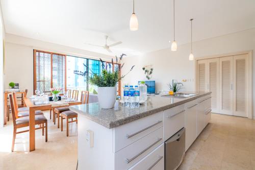 a kitchen and dining room with a table and chairs at Park view Avalon Apartment District 1 HCM City in Ho Chi Minh City