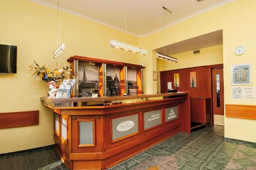 a lobby with a reception counter in a building at Hotel am Bahnhof in Aachen