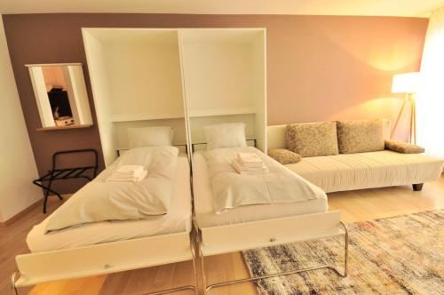 מיטה או מיטות בחדר ב-Lorez 5A by Arosa Holiday