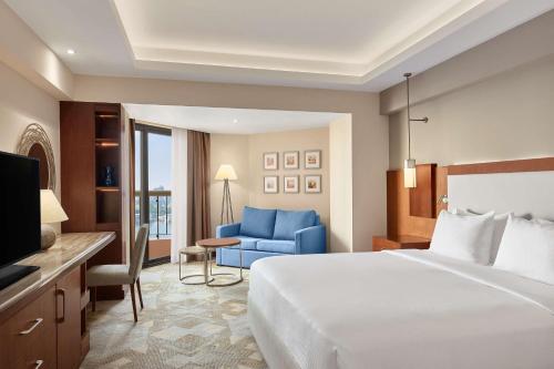 Postel nebo postele na pokoji v ubytování Ramses Hilton Hotel & Casino