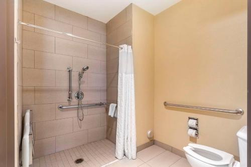 a bathroom with a shower and a toilet at Comfort Inn North/Polaris in Columbus