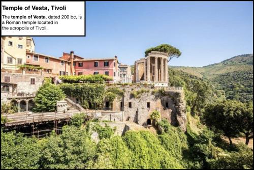a building on top of a hill at Le Ville Tivoli - Suites, Tivoli City Center! in Tivoli