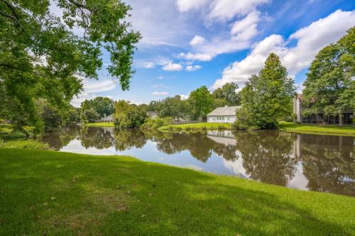 a view of a river with trees and a house at Condo Serenity in Charleston