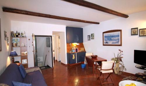 a living room with a couch and a table at La casa nel cuore di Camogli in Camogli