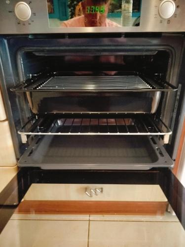 a toaster oven with a rack inside of it at Periklis House in Ixia