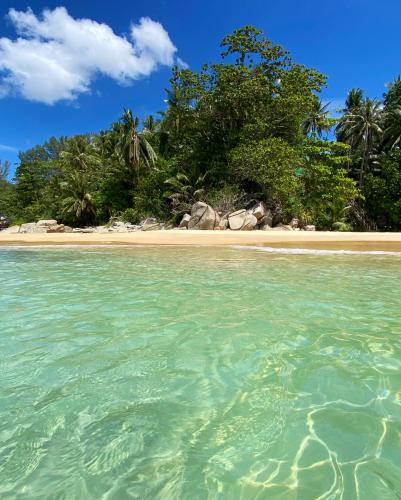 an island in the ocean with a sandy beach at Beachfront 2br 2bath apartment private plunge pool 50 meter to Naithon beach in Nai Thon Beach