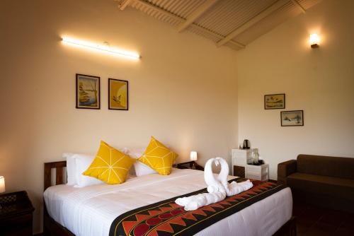 Postel nebo postele na pokoji v ubytování Ibex Resorts, Kotagiri