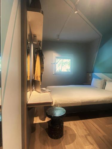 Un ou plusieurs lits dans un hébergement de l'établissement Hotel Ibis Budget Montpellier Centre Millenaire -