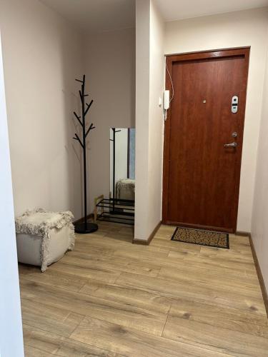 a room with a wooden door and a wooden floor at luksio 14 in Kėdainiai
