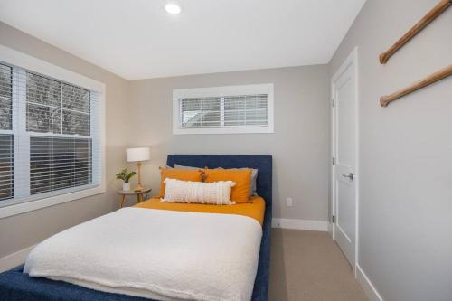 a bedroom with a bed and a window at Hot Tub - Saugatuck - Douglas - Luxury Home Sleeps 8 in Douglas