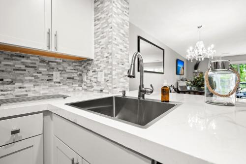 a kitchen with a sink and a counter top at Condo at the Lakes in Charleston