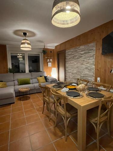 a kitchen and living room with a table and chairs at Warehouse Sierra Nevada in Sierra Nevada