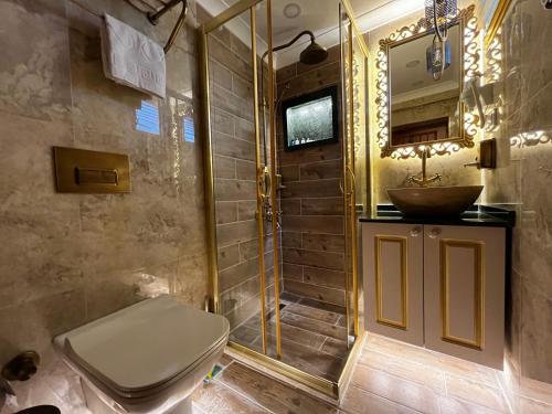 a bathroom with a toilet and a sink at Lily Mansion in Istanbul