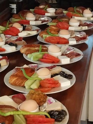 a bunch of plates of food on a table at Jasmin Apart Otel in Göcek