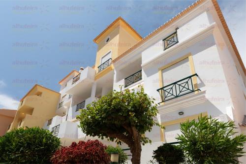 a view of the apartment building at Jardins de Santa Eulália By Albufeira Rental in Albufeira