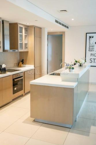 a kitchen with a sink and a counter top at Quill Residence at Paramount Towers 3 BR Creek View in Dubai