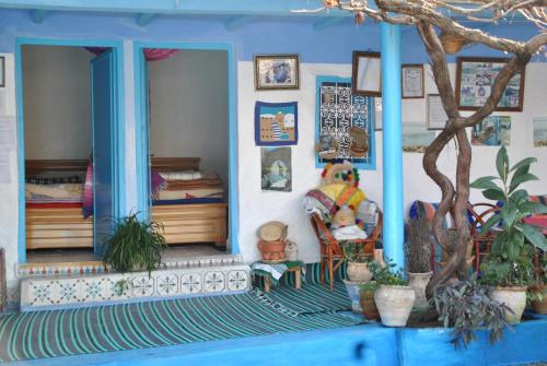 a doll house with a room with two beds at Ferme Dar Aicha green Bellouta in Bellouta