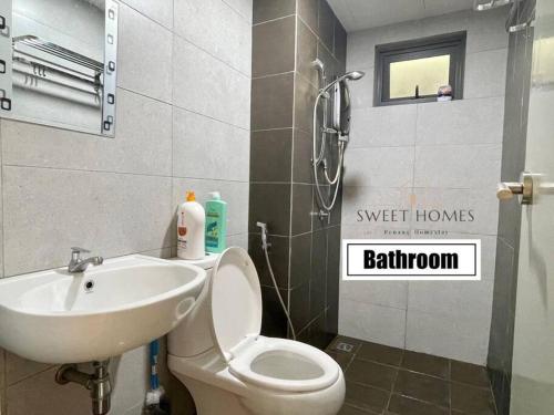 a bathroom with a toilet and a sink at Catty Suite Prai • 3BR • 2Carparks@6mins PG Bridge in Perai