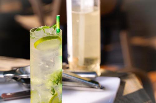 a drink with a lime on a table at B&B under Great Wall in Huairou
