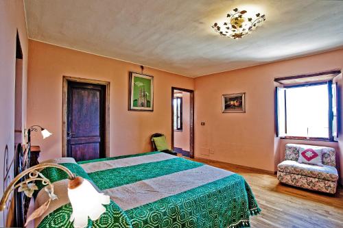 Katil atau katil-katil dalam bilik di Agriturismo Terra Di Michelangelo