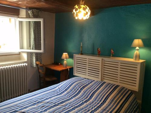 a bedroom with a bed and a desk and a window at Chalet Valloire, 5 pièces, 8 personnes - FR-1-263-397 in Valloire