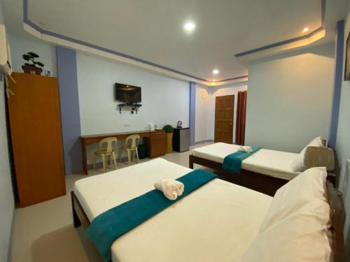 Säng eller sängar i ett rum på Merangie Travellers Inn