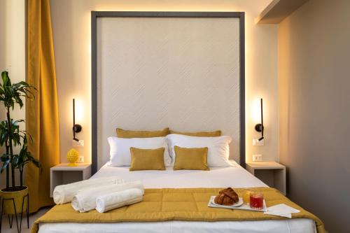 a bedroom with a large bed with a tray of food on it at Trastevere 143 in Rome