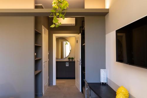 a hallway of a house with a tv on the wall at Trastevere 143 in Rome
