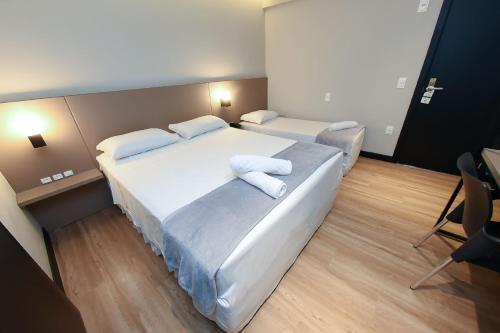 Postel nebo postele na pokoji v ubytování Arco do Sol Park Hotel