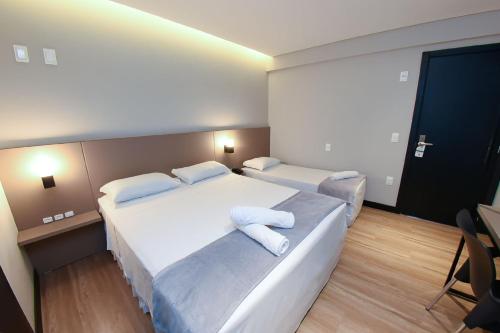 Postel nebo postele na pokoji v ubytování Arco do Sol Park Hotel