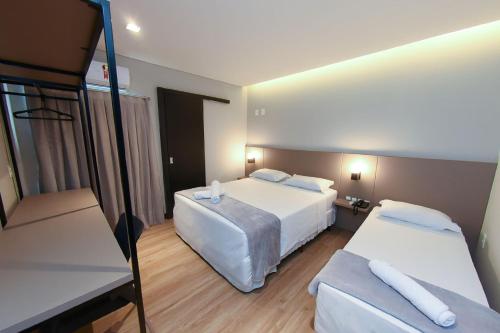 Postel nebo postele na pokoji v ubytování Arco do Sol Park Hotel