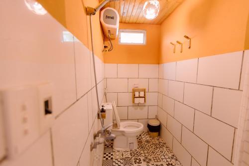 a small bathroom with a toilet in a room at The November - Moc Chau in Mộc Châu