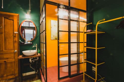 a bathroom with a sink and a mirror at Kar-Wai's in Ho Chi Minh City