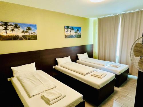 Postel nebo postele na pokoji v ubytování Hotel City Star