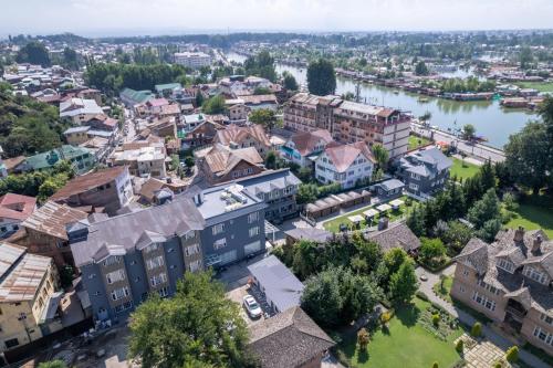an aerial view of a city with a river and buildings at Hotel Grand Boulevard Dal Lake View Srinagar in Srinagar