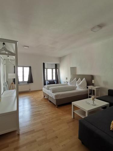 a living room with two beds and a couch at Little City Center Golden Roof 12 in Innsbruck