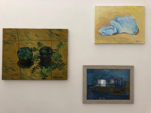 two paintings of plants hanging on a wall at The House of the poet in Civitavecchia