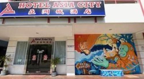 a hotel asahi city sign in front of a building at OYO 90847 Hotel Asia City in Kota Kinabalu