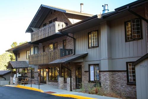a large brick building with a balcony on a street at Studio Apartment in Estes Park
