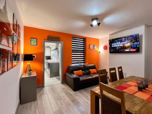 a living room with a couch and a table at St Michael's House - Great for Contractors or Family Holidays in Nottingham
