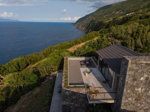 an aerial view of a house with a view of the ocean at Lava Homes in Santo Amaro