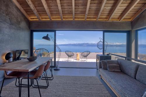a living room with a couch and a table at Lava Homes in Santo Amaro