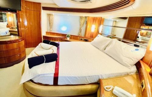 a large bed in a room on a yacht at luxerholiday in Antalya