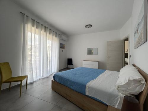 Postel nebo postele na pokoji v ubytování LUNA e AMBRA case vacanze