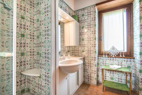 a bathroom with a sink and a mirror at Luxury Villa Spoleto in Spoleto