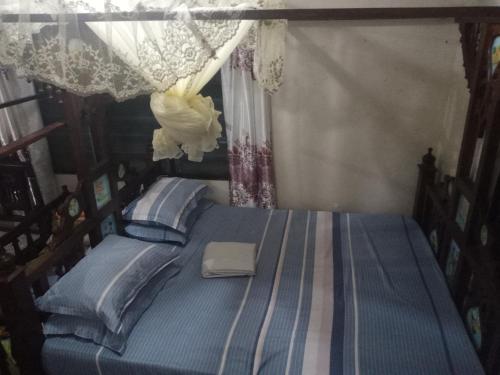 Posteľ alebo postele v izbe v ubytovaní Yaye House