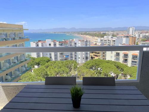 a balcony with a table and a view of the ocean at Rentalmar Blue Beach & Pool in Salou
