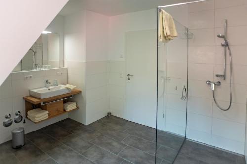 a bathroom with a sink and a shower at Huberhof Pfaffenbach in Gengenbach