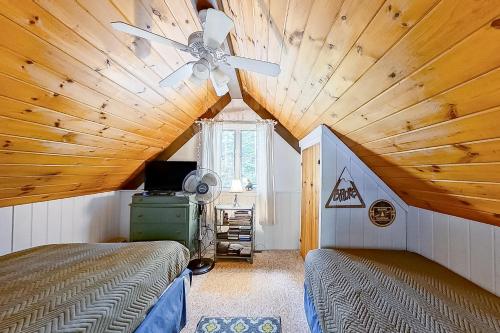 a bedroom with two beds and a ceiling fan at 79 Covered Bridge Lane in Bartlett