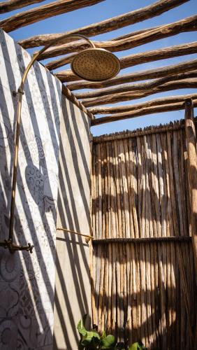 a building with a striped roof with a window at GUAJIRA CASA DEL MAR in Ríohacha